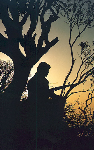 An SAS Sentry on the alert as dusk falls in Dhofar. Courtesy of B.M. Niven