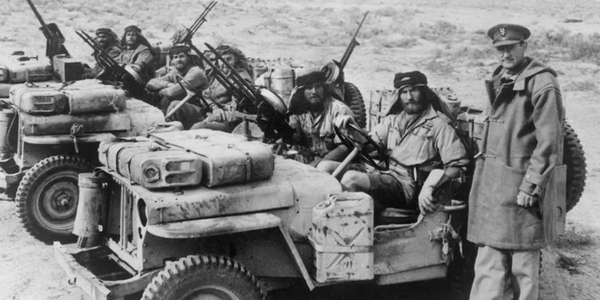 David Stirling with jeeps in desert
